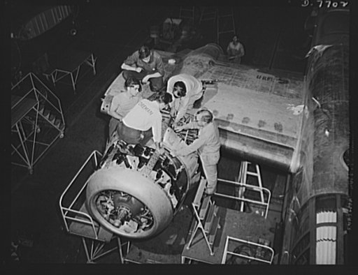 Production. B-25 "Billy Mitchell" bombers. Under the close supervision of a foreman a new engine assembly is installed in a B-25 bombers at North American Aviation's Inglewood, California, plant. In addition to the battle-tested B-25 "Billy Mitchell" bomber, used in General Doolittle's raid on Tokyo