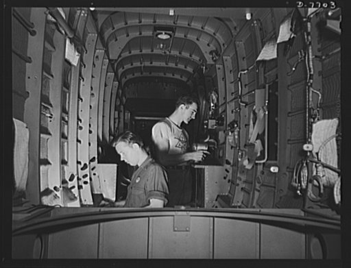 Production. B-25 "Billy Mitchell" bombers. North American Aviation employees at Inglewood, California, assemble parts inside the rear fuselage section of a B-25 bomber. In addition to the battle-tested B-25 "Billy Mitchell" bomber, used in General Doolittle's raid on Tokyo, this plant produces the P