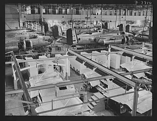 Production. B-25 "Billy Mitchell" bombers. A partial view of one of North American Aviation's B-25 bomber final assembly lines at Inglewood, California. In the foreground is an overhead conveyor line for bomber center sections. In addition to the battle-tested B-25 "Billy Mitchell" bomber, used in G