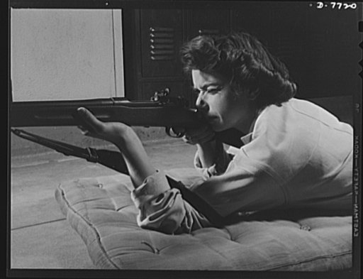 High school Victory Corps. This sharpshooter is captain of the girls' rifle team of Roosevelt High School, Los Angeles, California. Rifle practice is one of the phases of the activities of the school's Victory Corps