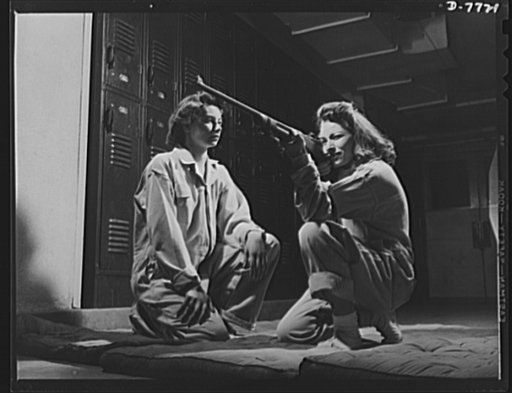 High school Victory Corps. These two sharpshooters are members of the girls' rifle team of Roosevelt High School, Los Angeles, California. Rifle practice is one of the phases of the activities of the school's Victory Corps