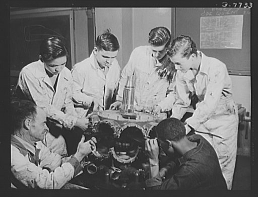 High school Victory Corps. Future airplane mechanics tear planes apart, build them up again in aeronautics class at Washington High School, Los Angeles, California