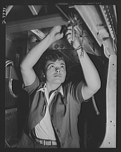 Production. P-51 "Mustang" fighter planes. This woman employee at the Inglewood, California, plant of the North American Aviation, assembles control cables inside the fuselage of a P-51 fighter. This plant produces the battle-tested B-25 "Billy Mitchell" bomber, used in General Doolittle's raid on T