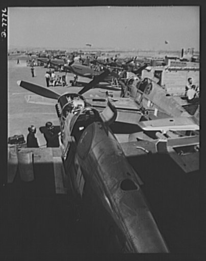 Production. P-51 ("Mustang) fighter planes. A partial view of North American's flight ramp at Inglewood, California. In the foreground is a P-51 fighter which has just rolled off the final assembly line. It is now awaiting its coat of war paint. This plant produces the battle-tested B-25 ("Billy Mit