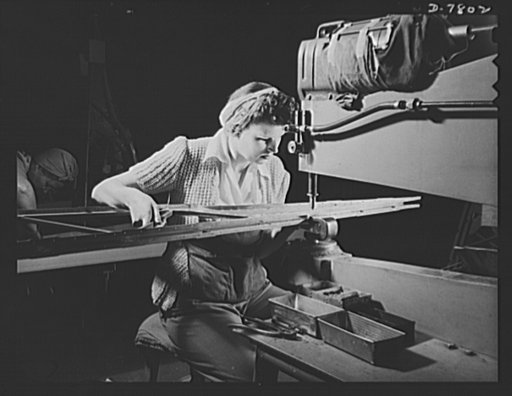 Production. B-17F heavy bombers. The careful, skilled fingers of women workers at the Long Beach, California, plant of Douglas Aircraft Company, prepare a wing rib for a mighty bomber. Better known as the "Flying Fortress," the B-17F is a later model of B-17, which distinguished itself in action in 