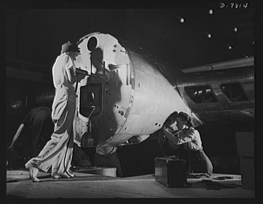 Production. B-17F heavy bombers. Women riveters in the Long Beach, California, plant of Douglas Aircraft Company. Better known as the "Flying Fortress," the B-17F is a later model of the B-17, which distinguished itself in action in the South Pacific, over Germany and elsewhere. It is a long range, 