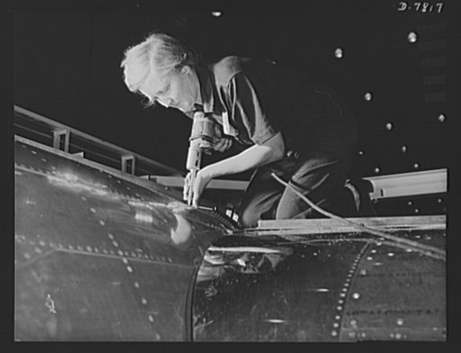 Production. B-17F heavy bombers. A women worker, over 60 years old, does an expert riveting job on a B-17F bomber in the Long Beach, California, plant of Douglas Aircraft Company. Better known as the "Flying Fortress," the B-17F is a later model of the B-17, which distinguished itself in action in t
