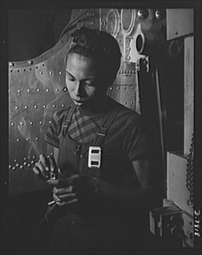 Production. B-17F heavy bombers. Negro girls are proving willing and capable aircraft workers. This girl works on wing jigs in the assembly of B-17F heavy bombers at the Long Beach, California, plant of Douglas Aircraft Company. Better known as the "Flying Fortress," the B-17F is a later model B-17,