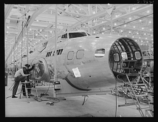 Production. B-17F heavy bombers. A line of fuselage nose sections for B-17F heavy bombers moving in an overhead conveyor trolley toward the final assembly line at the Long Beach, California, plant of Douglas Aircraft Company. Better known as the "Flying Fortress," the B-17F is a later model B-17, wh