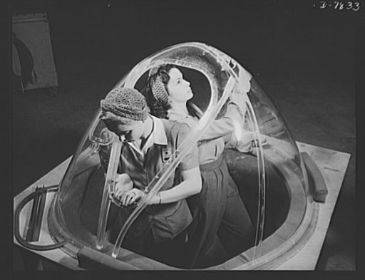 Production. B-17F heavy bombers. Two girl workers in the Long Beach, California, plant of the Douglas Aircraft Company, put finishing touches on the bombardier nose section of a B-17F heavy bomber. Better known as the "Flying Fortress," the B-17F is a later model B-17, which distinguished itself in 