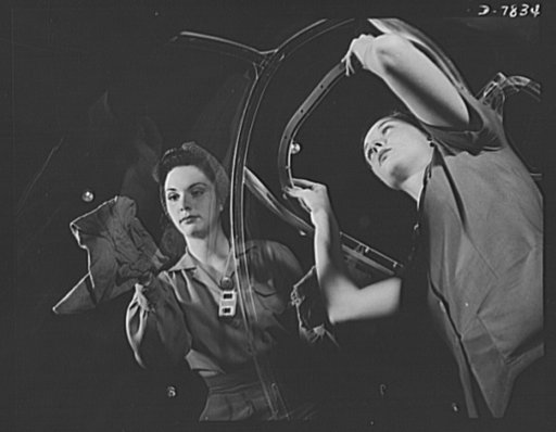 Production. B-17F heavy bombers. Two girl workers in the Long Beach, California, plant of the Douglas Aircraft Company, put finishing touches on the bombardier nose section of a B-17F heavy bomber. Better known as the "Flying Fortress," the B-17F is a later model B-17, which distinguished itself in 