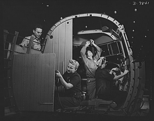 Production. Airplane maufacture, general. Experienced men help women trainees to learn the intricacies of modern airplane construction at the Long Beach, California, plant of Douglas Aircraft Company. Most important of the many types of aircraft made at this plant are the B-17F ("Flying Fortress") h