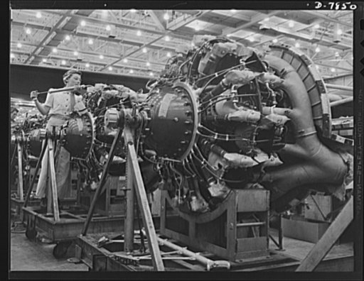 Production. Airplane maufacture, general. A woman airplane engine mechanic at the Long Beach, California, Douglas Aircraft Company. She was carefully trained by experts in the company school. Most important of the many types of aircraft made at this plant are B-17F ("Flying Fortress") heavy bomber, 