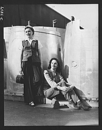 Production. Airplane maufacture, general. Two assembly line worker at the Long Beach, California, plant of Douglas Aircraft Company, enjoy a well-earned lunch period. Nacelle parts for a heavy bomber form the background. Most important are the many types of aircraft made at this plant are the B-17F 
