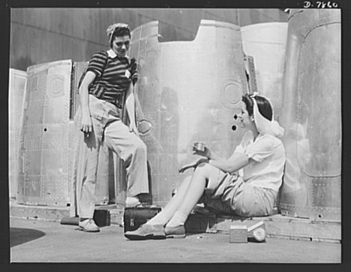 Production. Airplane maufacture, general. Two assembly line worker at the Long Beach, California, plant of Douglas Aircraft Company, enjoy a well-earned lunch period. Nacelle parts for a heavy bomber form the background. Most important are the many types of aircraft made at this plant are the B-17F 
