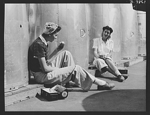 Production. Airplane maufacture, general. Two assembly line worker at the Long Beach, California, plant of Douglas Aircraft Company, enjoy a well-earned lunch period. Nacelle parts for a heavy bomber form the background. Most important are the many types of aircraft made at this plant are the B-17F 