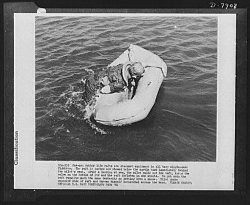 One man rubber life rafts are standard equipment in all Navy single-seat fighters. The raft is packed and stowed below the turtle back immediately behind the pilot's seat. After a landing at sea, the pilot pulls out the raft, turns the valve on the bottle of CO2 and the raft inflates in one minute. 