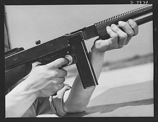 Fort Knox. Machine guns. The .45 caliber Thompson sub-machine gun, familiarly known as the Tommy gun, is a hand weapon for which every branch of the service finds many uses. Its portability and effectiveness makes it a favorite of our modern Army