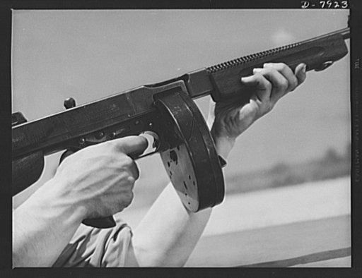 Fort Knox. Machine guns. The .45 caliber Thompson sub-machine gun, familiarly known as the Tommy gun, is a hand weapon for which every branch of the service finds many uses. Its portability and effectiveness makes it a favorite of our modern Army