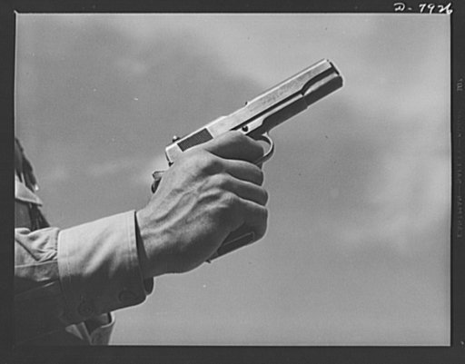 Fort Knox. Colt automatic pistol. A soldier in training at Fort Knox, Kentucky, demonstrates the use of one of America's renowned weapons, a Colt pistol. Much changed in appearance from the gun that was famous on our frontiers nearly a century ago, this .45 caliber automatic is one of the standard w