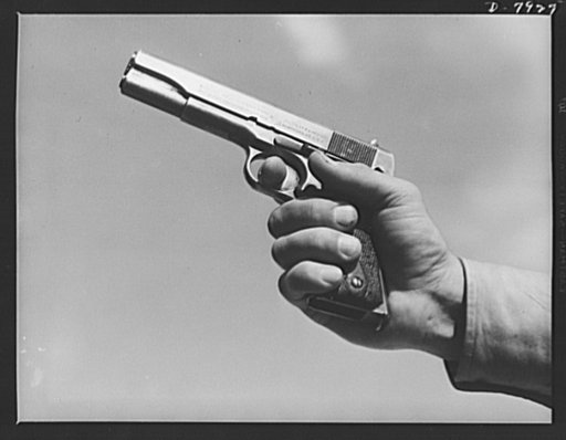 Fort Knox. Colt automatic pistol. A soldier in training at Fort Knox, Kentucky, demonstrates the use of one of America's renowned weapons, a Colt pistol. Much changed in appearance from the gun that was famous on our frontiers nearly a century ago, this .45 caliber automatic is one of the standard w