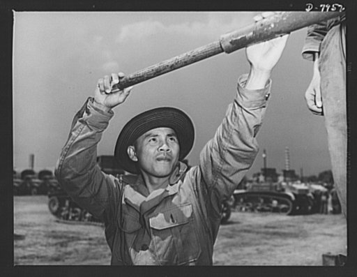 Fort Knox. M-3 tank crews. Teodile C. Orpilta, Filipino member of an M-3 tank crew in training at Fort Knox, Kentucky, cleans one of the guns on this tank. The Fort Knox school for tank crews has graduated many men who are now ready to meet the Axis on our far-flung battle lines and on more than equ