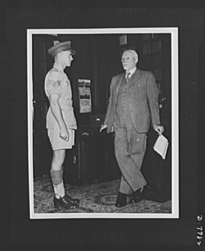 Field Marshall Smuts and Victoria Cross Winner. Latest official photograph of Field Marshall J.C. Smuts, currently in London to confer with British Prime Minister Churchill on the conduct of the war. He is shown in his office at Union Building, Pretoria, South Africa, greeting Sergeant Quintin Smyth