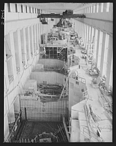 Tennessee Valley Authority. Looking down the partly-finished generator room of a new addition to TVA's hydroelectric plant at Wilson Dam. Concrete work for the scroll case and draft tube is completed up to the scroll case roof. Located near Sheffield, Alabama, 260 miles above the mouth of the Tennes