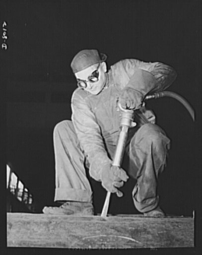 Production. Steam power plant equipment. Chipping slag from a long arc-welded seam of a new high-pressure boiler. Steam boilers and other power-house equipment to supplement the hydroelectric installations of the Tennessee Valley Authority (TVA) system are produced in the large Chattanooga shops of 