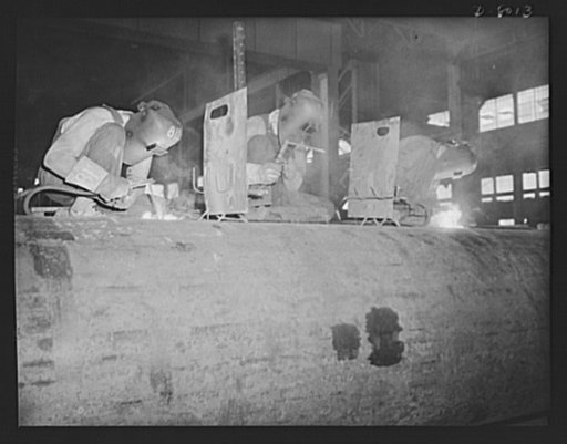 Production. Steam power plant equipment. Electric arc-welders run a long seam on a new high-pressure boiler. Steam boilers and other power-house equipment to supplement the hydroelectric installations of the Tennessee Valley Authority (TVA) system are produced in the large Chattanooga shops of the C