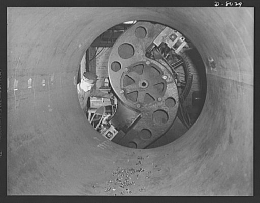 Production. Steam power plant equipment. Looking down on a boring mill through the end of a drum shell for a new high-pressure boiler. Steam boilers and other power-house equipment to supplement the hydroelectric installations of the Tennessee Valley Authority (TVA) system are produced in the large 