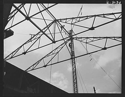 Production. Steam power plant equipment. Erecting the structural work of a new shop for the machining of marine boiler headers. Steam boilers and other power-house equipment to supplement the hydroelectric installations of the Tennessee Valley Authority (TVA) system are produced in the large Chattan
