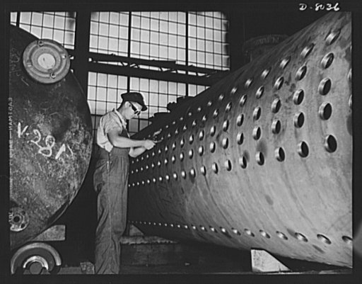 Production. Steam power plant equipment. Filling tube holes on a high-pressure boiler drum. Steam boilers and other power-house equipment to supplement the hydroelectric installations of the Tennessee Valley Authority (TVA) system are produced in the large Chattanooga shops of the Combustion Enginee