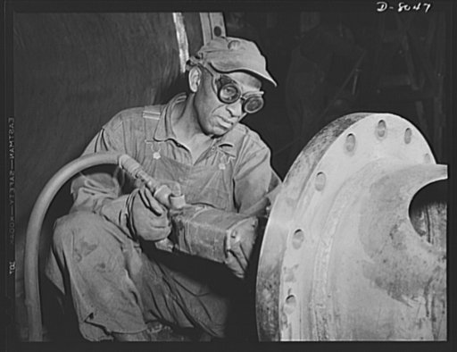 Production. Steam power plant equipment. Grinding an inside girth seam on a heat exchanger for a high-pressure boiler. Steam boilers and other power-house equipment to supplement the hydroelectric installations of the Tennessee Valley Authority (TVA) system are produced in the large Chattanooga shop