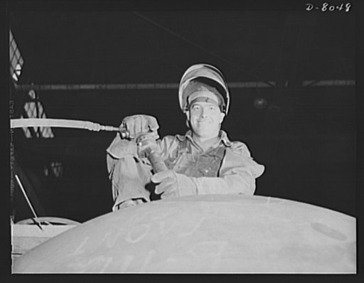 Production. Steam power plant equipment. A workman with a large chipping hammer to cut away excess metal in girth of a high-pressure boiler. Steam boilers and other power-house equipment to supplement the hydroelectric installations of the Tennessee Valley Authority (TVA) system are produced in the 