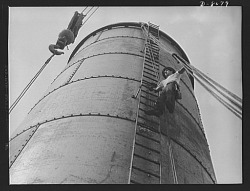 Tennessee Valley Authority. Watts Bar Dam hydroelectric plant. A husky ironworker at TVA's Watts Bar steam plant, directs the hoisting of a section for a 16-foot by 60-foot stack. This plant will supplement the big hydroelectric installation at Watts Bar Dam, which has an authorized output of 90,000