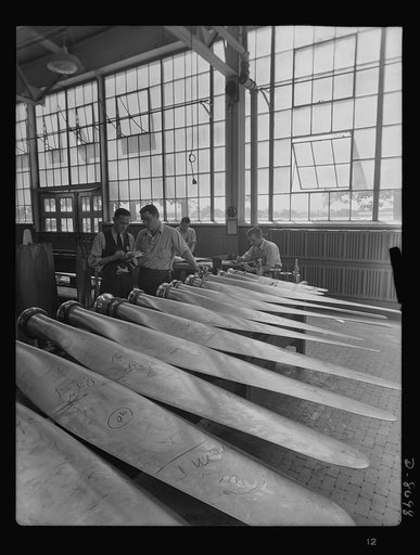 Production. Airplane propellers. Inspection of propeller blade finishes at Hartford, Connecticut, plant. The inspection process includes close examination of the polish. The inspectors are John Lutz, F.S. Drega and Joseph Kozlowski
