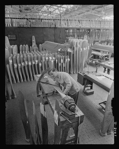 Production. Airplane propellers. Arthur Voss checks angles and makes final dimensional inspections of a propeller blade for an American warplane at the Hartford, Connecticut, plant. This blade will later be mounted with others in a hydromatic mechanism that will permit adjustment of pitch while plan