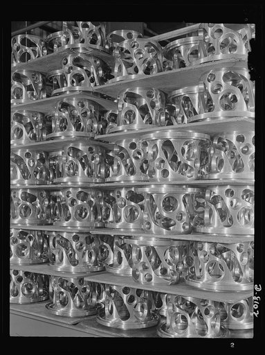 Production. Airplane propellers. Finished stationary cams for the hydraulic mechanism that adjust the pitch of airplane propeller blades while planes are in action. The Hartford, Connecticut, plant, where they are stored in turning out great numbers of two- three- and four-blade propellers