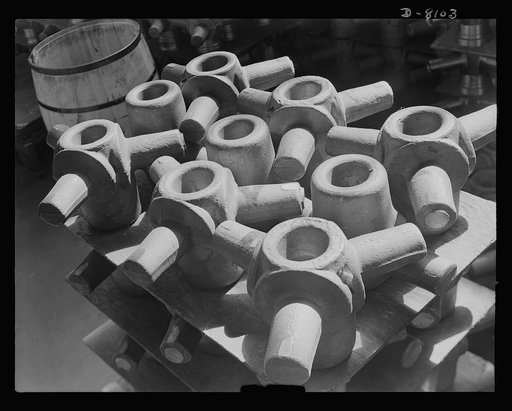 Production. Airplane propellers. Three-way spider forgings for the hydraulic mechanism that adjust propeller blade pitch await precision machining at a Hartford, Connecticut, plant. This plant produces great numbers of variable pitch propellers with two-, three- and four-blade propellers