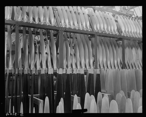 Production. Airplane propellers. Finished propeller blades ready for assembly at a Hartford, Connecticut, plant. These blades will later be mounted in combinations of two, three and four in hydromatic mechanisms that permit adjustments of blade pitch while planes are in action