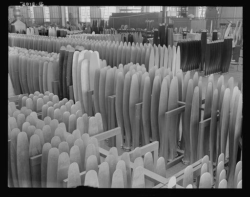 Production. Airplane propellers. Finished propeller blades ready for assembly at a Hartford, Connecticut, plant. These blades will later be mounted in combinations of two, three and four in hydromatic mechanisms that permit adjustments of blade pitch while planes are in action