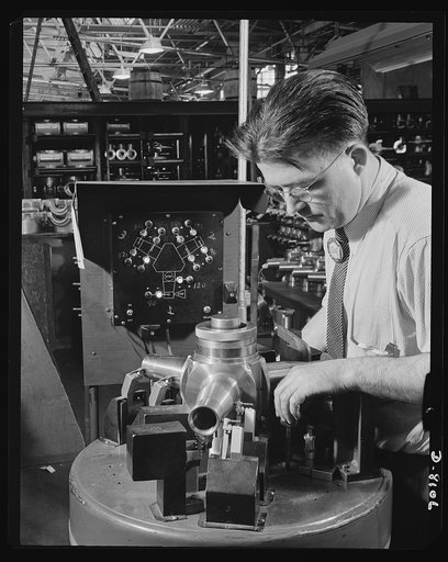 Production. Airplane propellers. Frank Geary uses an electro-limit gauge at a Hartford, Connecticut, plant to make final inspections of a three-way hydromatic spider that form part of the mechanism which varies the pitch of airplane propeller blades while planes are in action. At this plant propelle