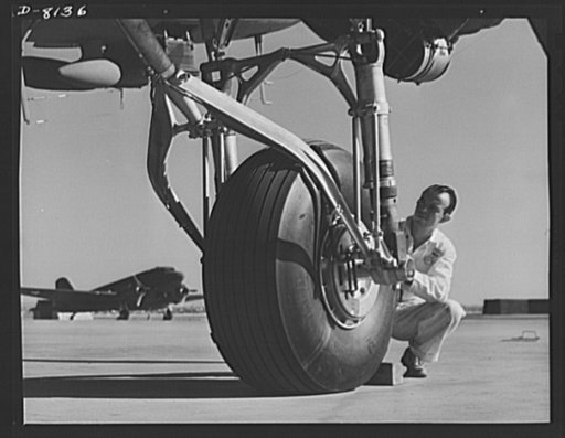 Production. C-47 transport planes. The rugged landing gear of a C-47 transport plane must stand terrific pounding over rough ground and emergency landing fields. Picture taken on the Long Beach, California, flight ramp of the Douglas Aircraft Company. The versatile C-47 performs many important tasks