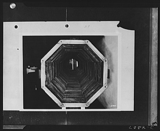 Substitute materials. Interior view of two-foot section of built-up wooden pipe, twenty-four inches in diameter. These pipes, used in place of corrugated iron or reinforced concrete pipes, are made of sections cut from short lengths of wood. About 100,000 feet of these wooden pipes were installed in