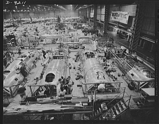 Production. B-17 heavy bomber. Fast, expert workers at the Boeing plant in Seattle apply outer "skins" to fuselage sections for new B-17F (Flying Fortress) bombers, while assembly and fitting operations go forward in the interiors. The Flying Fortress has performed with great credit in the South Pac