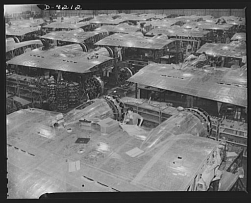 Production. B-17 heavy bomber. Wing sections, each containing two powerful Wright engines, await mating with fuselage sections of new B-17F (Flying Fortress) bombers in Boeing's big Seattle plant. The Flying Fortress has performed with great credit in the South Pacific, over Germany and elsewhere. I