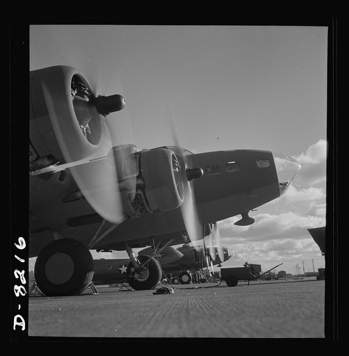Production. B-17 heavy bomber. Two of the four mighty engines of a new B-17F (Flying Fortress) bombers warm up at the airfield of Boeing's Seattle plant as another warship of the air awaits its flight test. The Flying Fortress has performed with great credit in the South Pacific, over Germany and el