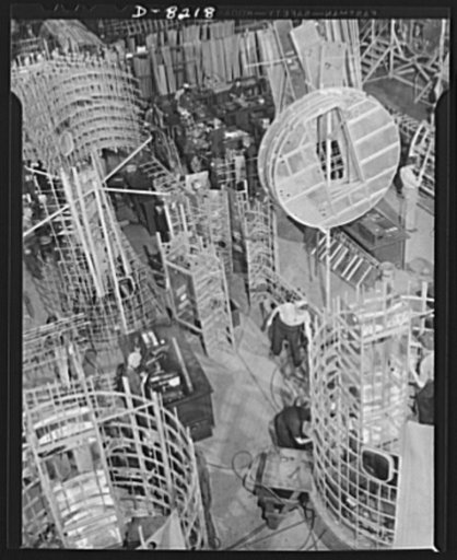 Production. B-17 heavy bomber. Sections of framework for a B-17F (Flying Fortress) bomber fuselages at the Boeing plant in Seattle. The Flying Fortress, has performed with great credit in the South Pacific, over Germany and elsewhere. It is a four-engine heavy bomber capable of flying at high altitu