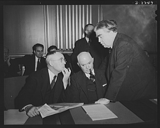 War Labor Board anthracite hearing. John L. Lewis, President of the United Mine Workers confers with Thomas Kennedy (left), Secretary-Treasurer of the UMW, labor member of the War Labor Board, and Pery Tetlow (center), President of the United Mine Workers, District 17, at the War Labor Board confere
